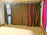 Bedroom off game room separated by curtains